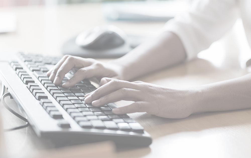 woman's hands at keyboard